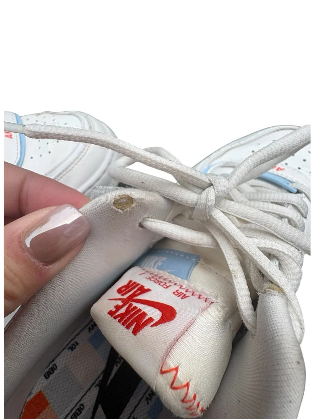 Nike Women’s White Sneakers with Orange Swoosh and Light Blue Accents